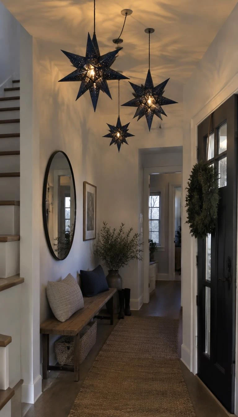 Arrange Navy Blue Paper Star Lanterns Above an Entry Console A candid, realistic iPhone photograph of a home entryway hall, showing three varied sizes of dark navy blue three dimensional paper star lanterns hanging from ceiling cords above a wood bench, soft warm bulb glowing within.