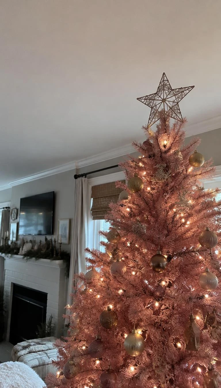 Top a Rose Tree with a Simple Wire Star A candid, realistic iPhone photograph of a living room with a Christmas tree, highlighting the top of a rose pink tree crowned with an unpainted iron wire star, clean plaster ceilings, and soft diffused daylight